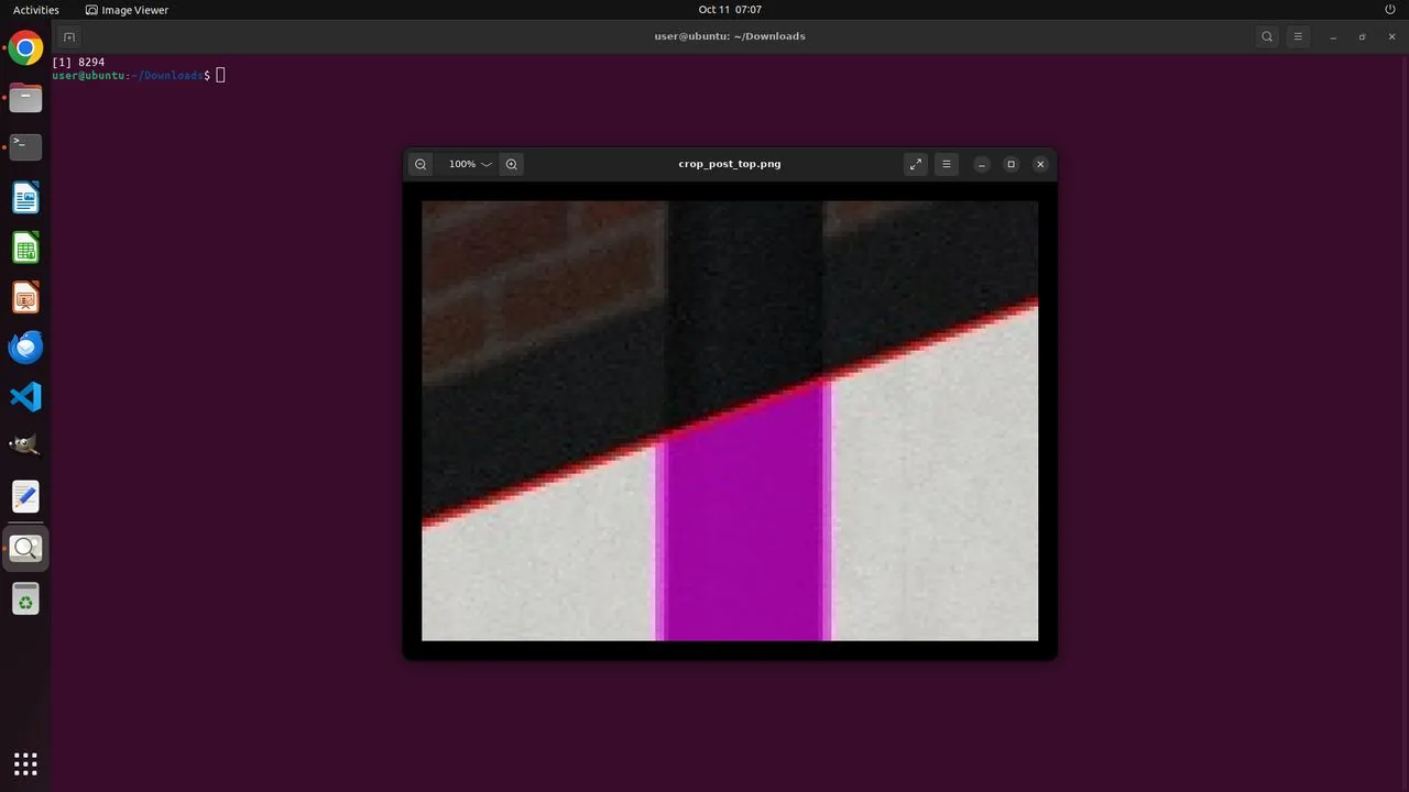 The agent's own check image, cropped from the Great Ancoats Street photo: the panel quad it detected (the red line is its top edge) follows the paper edge, and its magenta occluder mask covers the lamp post standing in front of the panel.